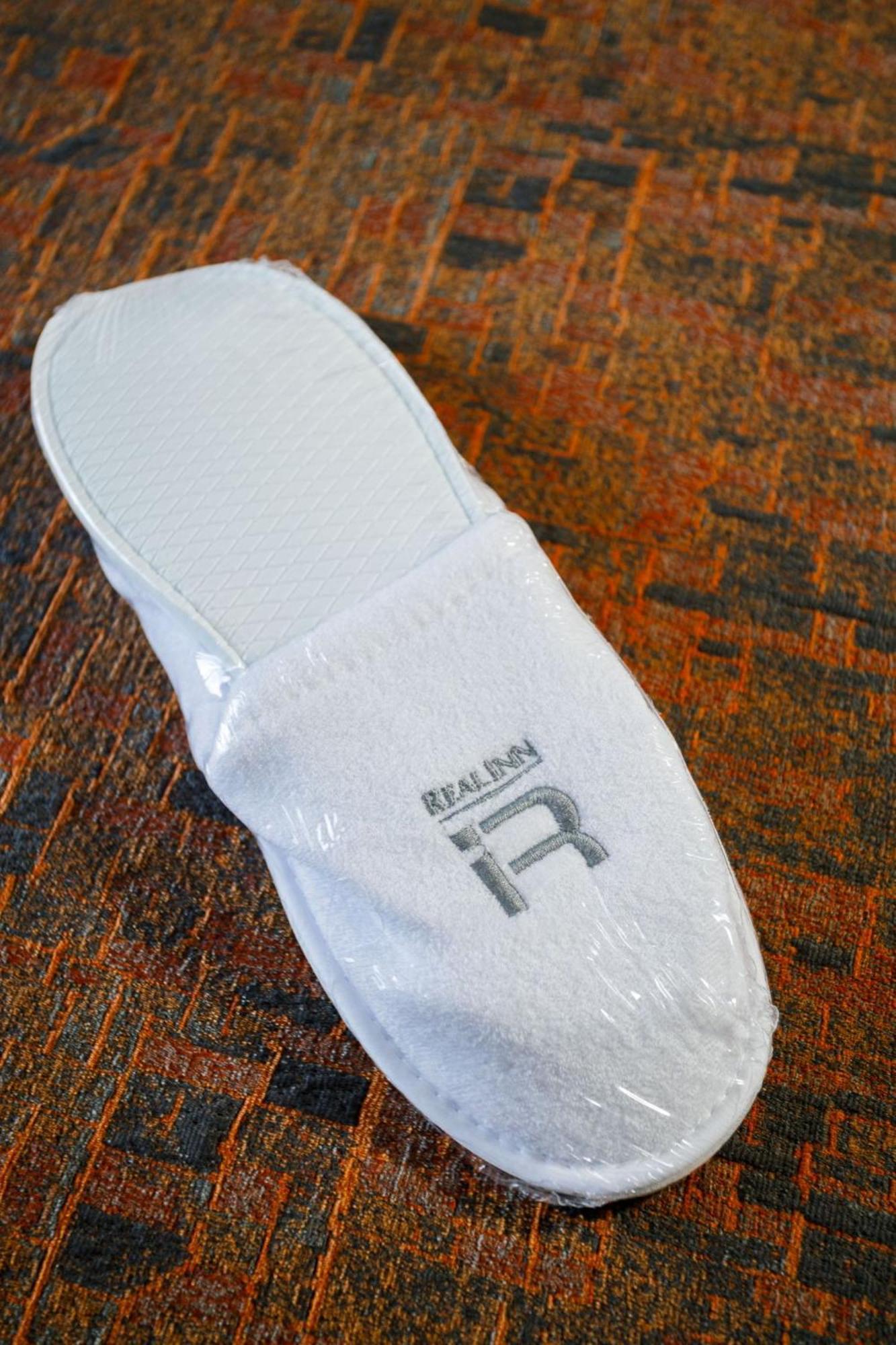 Real Inn Tijuana By Camino Real Hoteles Extérieur photo A pair of hotel slippers